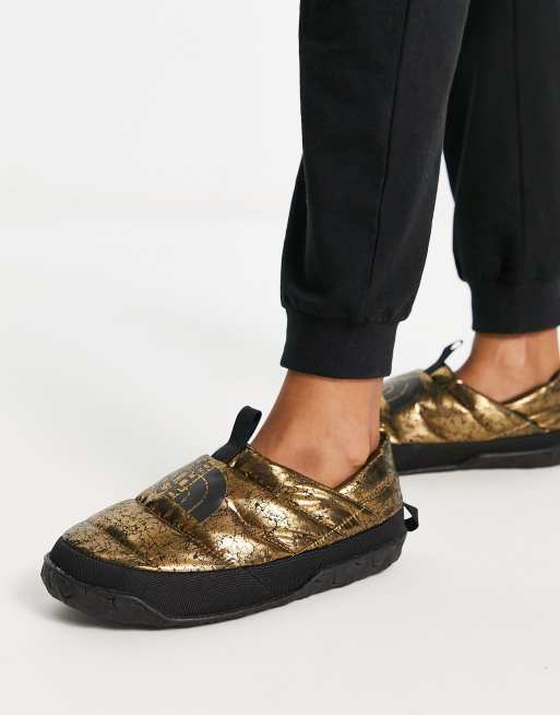 The North Face Nuptse down insulated mules in gold | ASOS