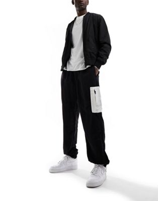 The North Face Nylon woven loose fit joggers in black and white