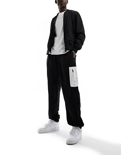 The North Face Nylon woven loose fit joggers in black and white | ASOS