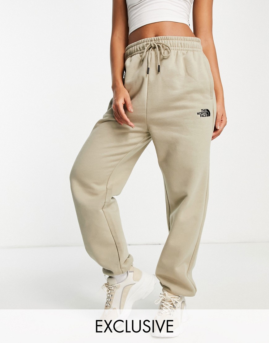 The North Face Oversized Essential sweatpants in beige Exclusive at ASOS-Neutral