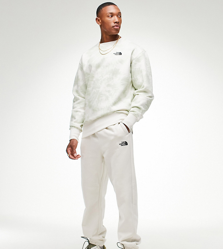 The North Face Oversized Essential sweatpants in cream Exclusive at ASOS-White