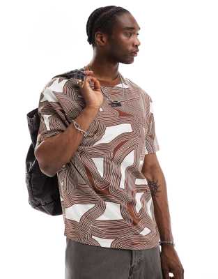 The North Face The North Face Oversized heavyweight t-shirt in brown geo print Exclusive at ASOS