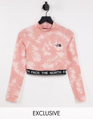 The North Face Perf cropped long sleeve t-shirt in pink tie dye Exclusive at ASOS