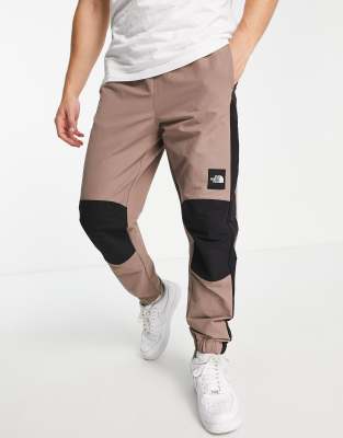 The North Face Phlego DryVent woven track trackies in taupe - ASOS Price Checker