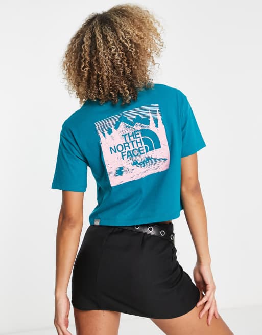 The North Face Redbox Celebration back print cropped t-shirt in teal Exclusive at ASOS