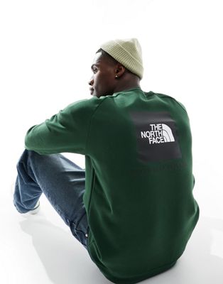 The North Face Redbox raglan sleeve back print fleece sweatshirt in pine green