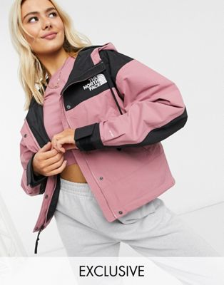 black and pink north face coat