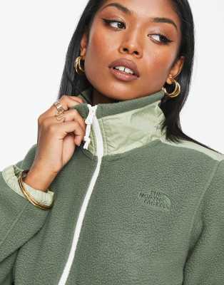 green north face zip up