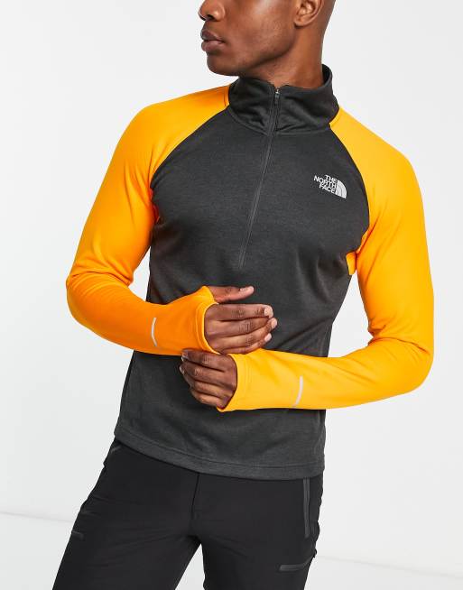 The North Face Running 1/4 Zip FlashDry long sleeve top in orange and black