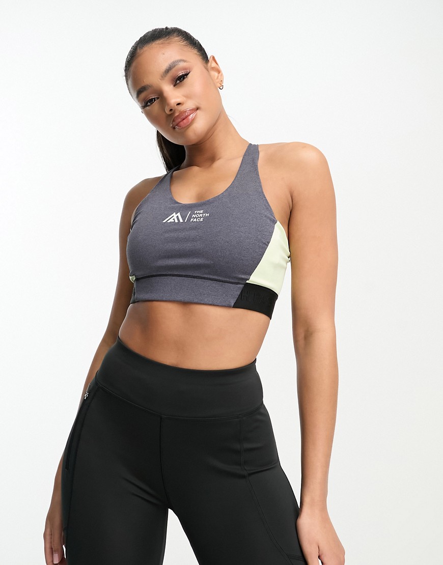 The North Face Running LAB mid support strap back sports bra in slate grey