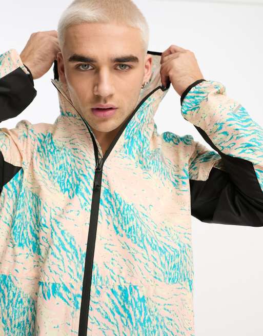The North Face – Running – Windjacke mit tropischem Trail-Print, Kapuze und Reißverschluss