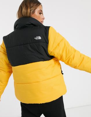 yellow and black north face puffer