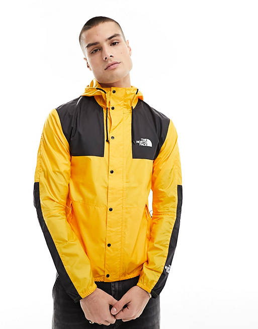The North Face Seasonal Mountain packable jacket in yellow and black | ASOS