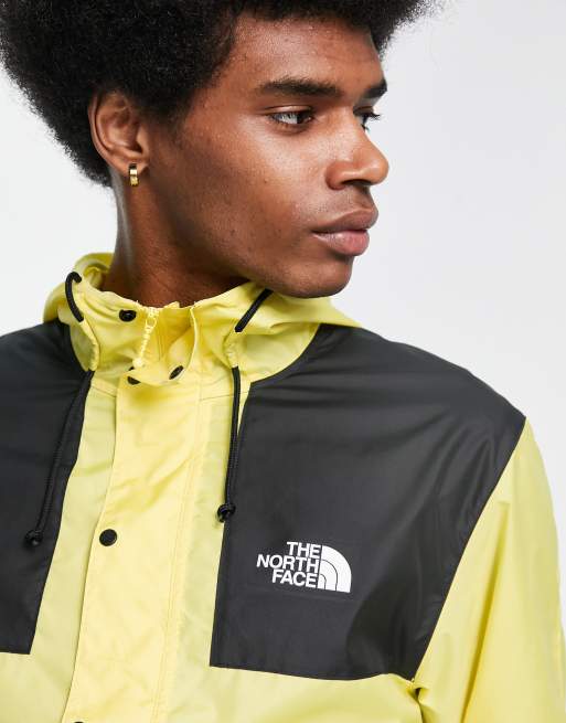 The North Face Seasonal Mountain water repellent hooded jacket in yellow and black