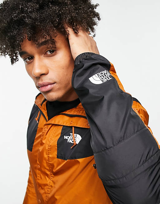 The North Face Seasonal Mountain water repellent jacket in brown and black  - Exclusive at ASOS