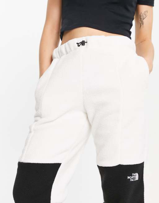 The North Face Shispare sherpa fleece joggers in cream Exclusive at ASOS