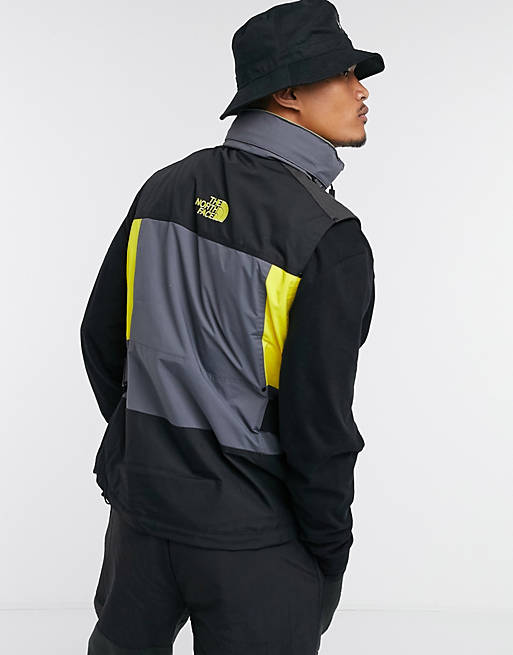 The North Face Steep Tech Apogee vest in yellow/gray