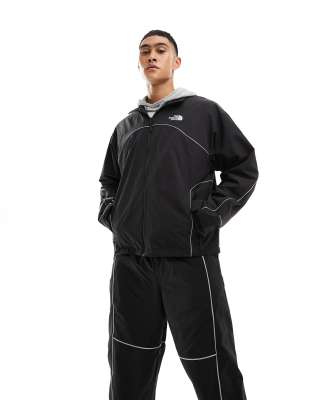 The North Face Relaxed Fit Piping Wind Jacket In Black
