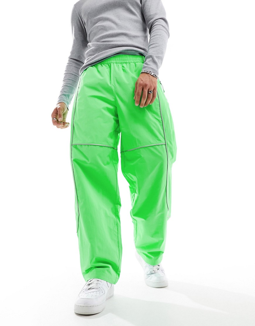 The North Face Tek woven joggers with reflective piping in bright green