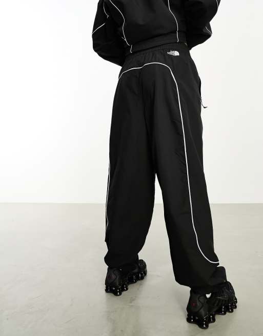 Black reflective best sale track pants