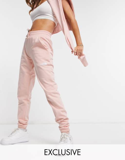 The North Face Tight track pants in light pink Exclusive to ASOS