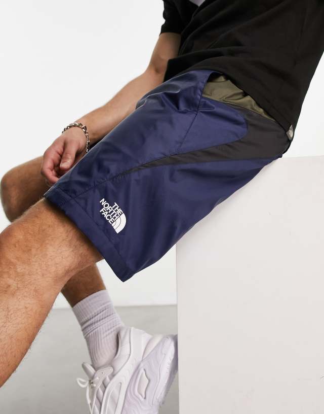 The North Face TNF X woven belted shorts in navy and khaki