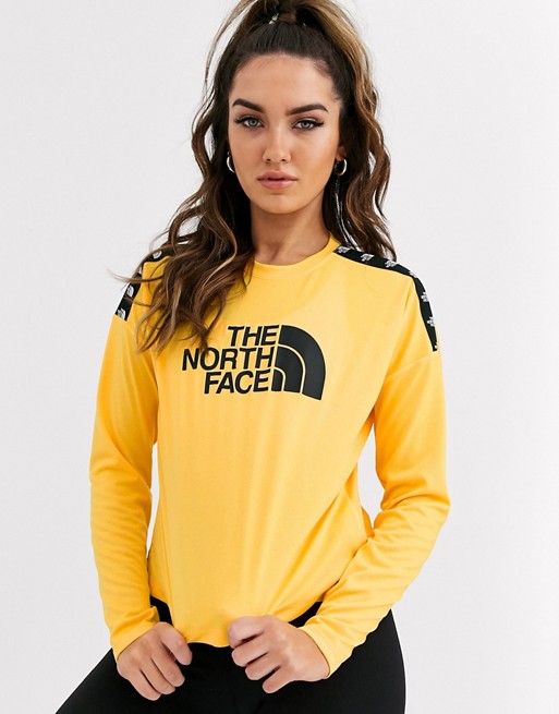 The North Face TNL long sleeve crop top in yellow
