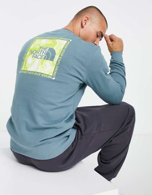 The North Face Topographic back print sweatshirt in goblin blue Exclusive at ASOS
