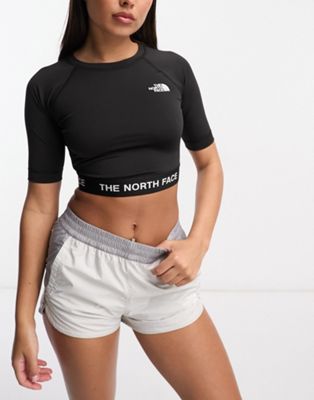 The North Face Training cropped long sleeve performance top in black