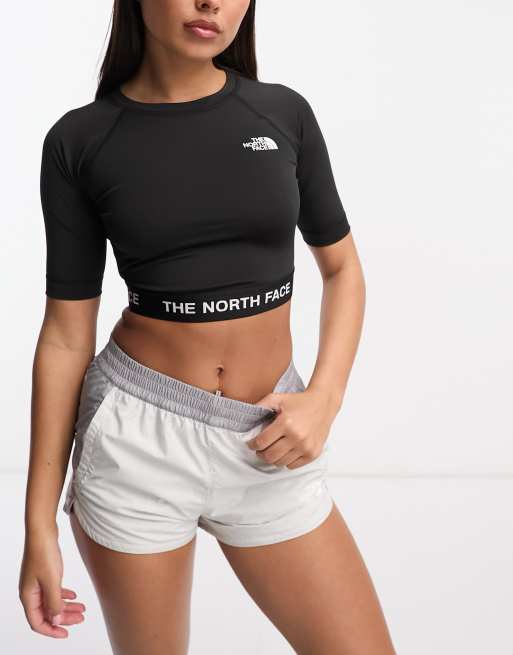 The North Face - Training - Cropped performance top met lange mouwen in zwart