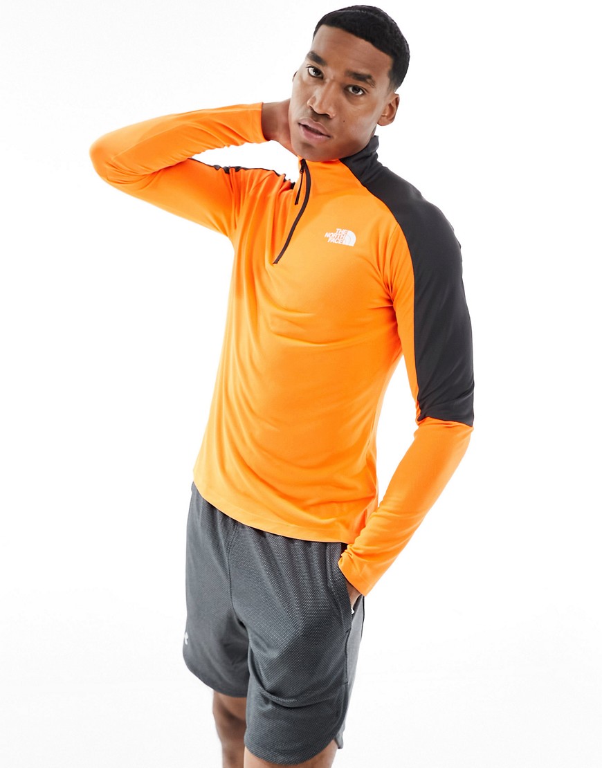 The North Face Training Mountain Athletic 1/4 zip long sleeve top in orange