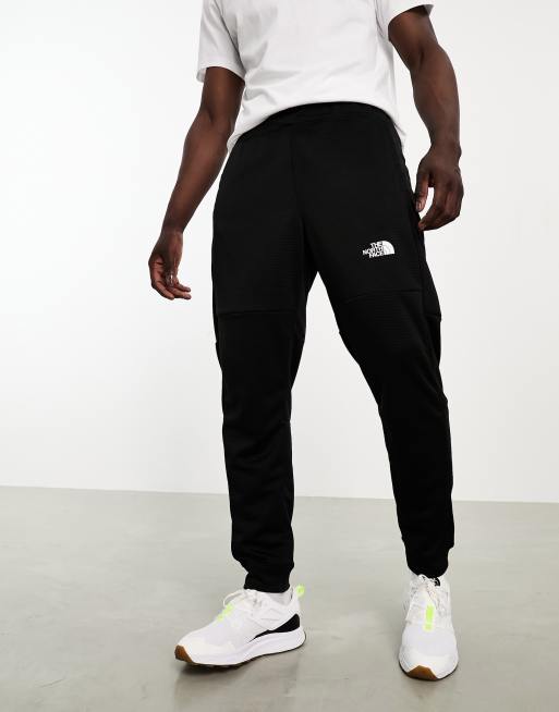 The North Face Training Mountain Athletic fleece joggers in black | ASOS