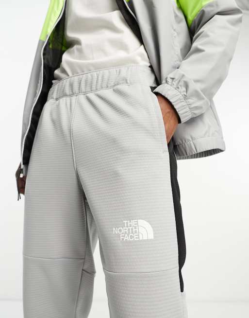 The north face train n logo track pants online grey