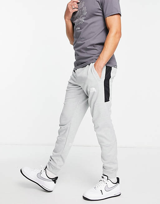 The North Face Training Mountain Athletic trackies in grey | ASOS
