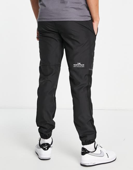 The North Face Training Mountain Athletics Wind Track joggers in