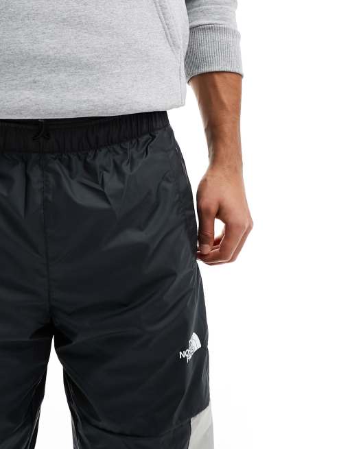 The North Face Training Mountain Athletics wind track joggers in