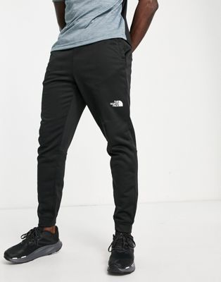 The North Face Training Reaxion fleece joggers in black