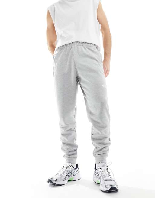 The North Face - Training Reaxion - Fleece joggingbroek in grijs