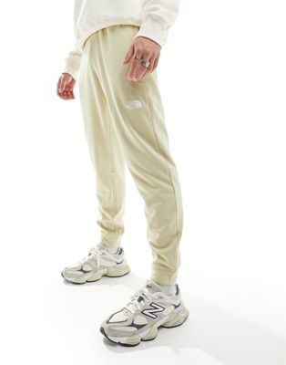 The North Face Training Reaxion logo joggers in beige heather-Neutral