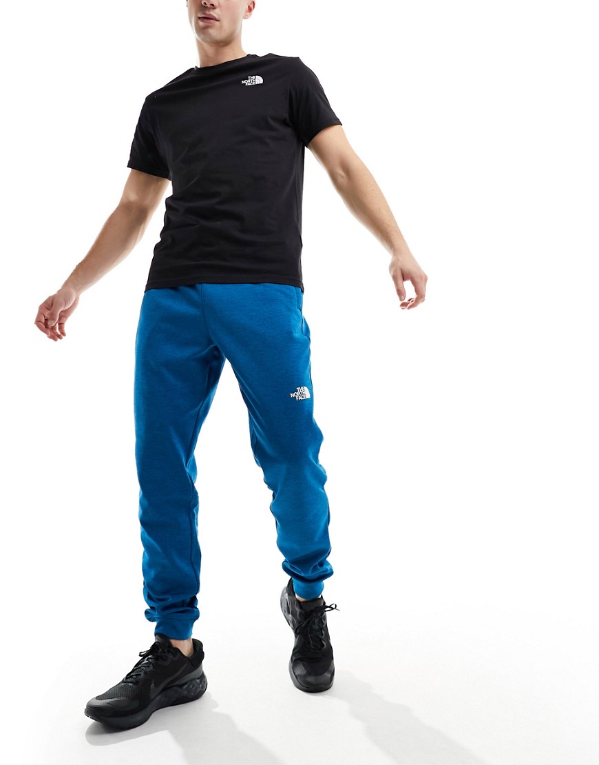 The North Face Training Reaxion logo joggers in blue heather