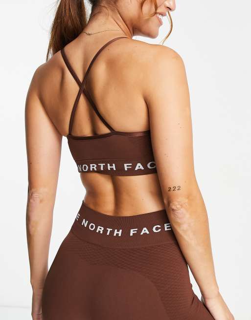 The North Face Training Tech sports bra in pink Exclusive at ASOS