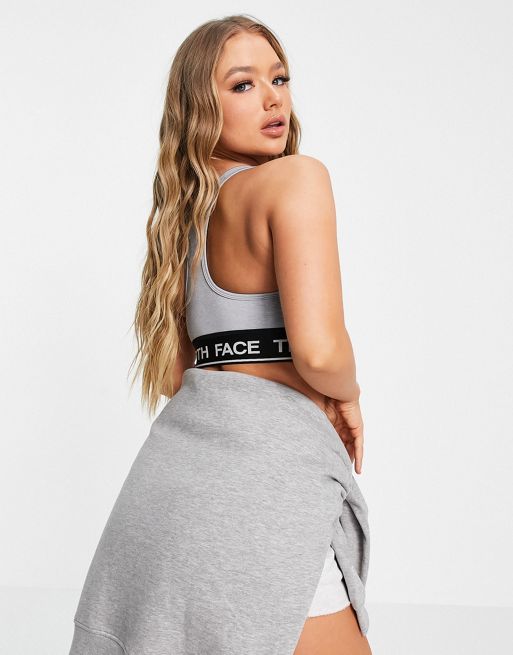 The North Face Training Tech sports bra in gray Exclusive at ASOS