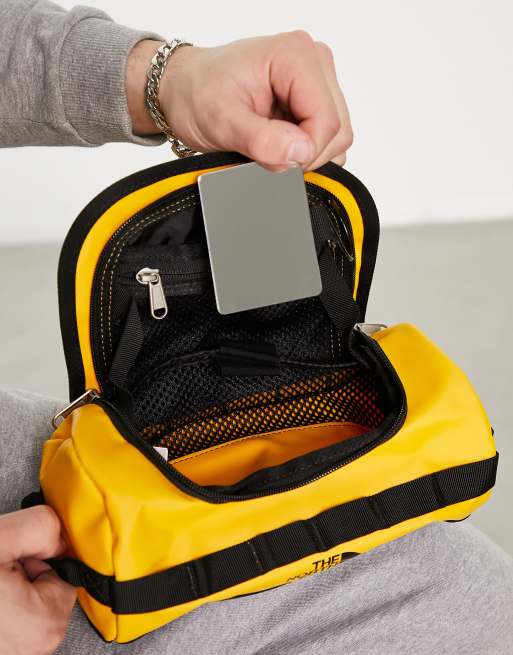 The North Face Travel Canister small 3.5l wash bag with internal mirror in yellow