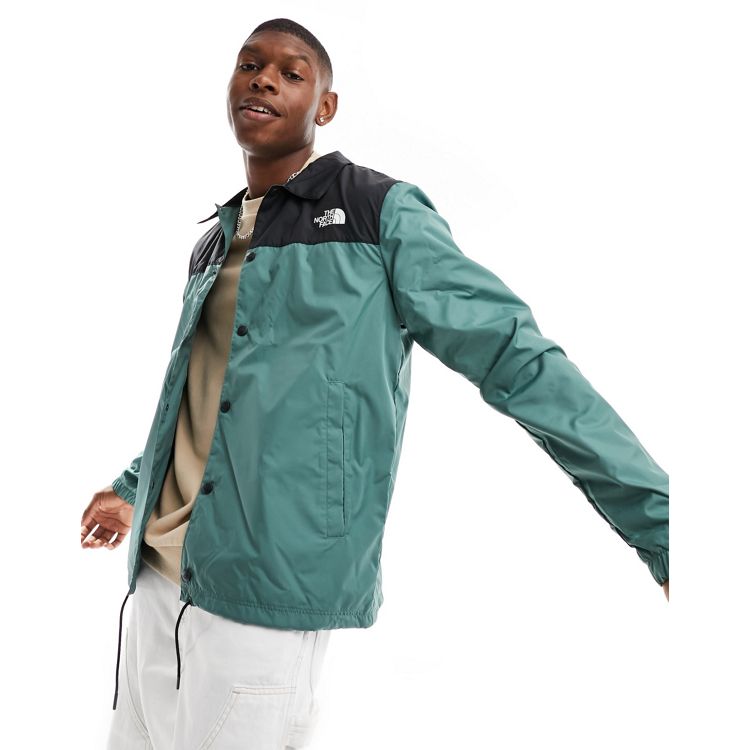 The North Face water-repellent coach jacket in green and black 