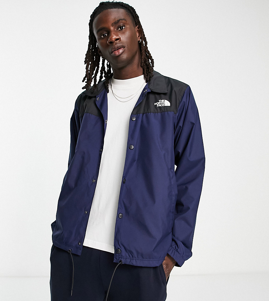 The North Face water repellent coach jacket in navy and black - Exclusive at ASOS