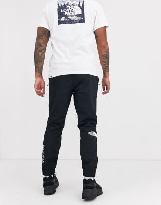 the north face windwall joggers in black