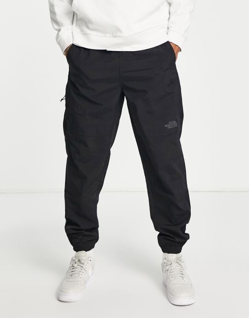 The North Face Woven trackies in black | ASOS