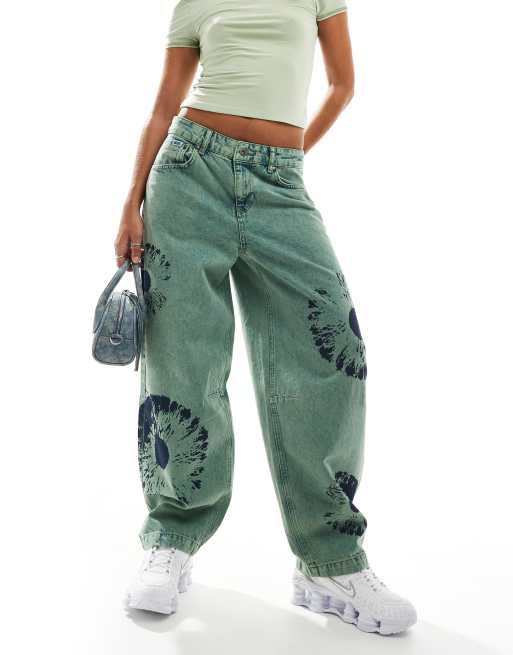 The Ragged Priest goliath jeans with bleach eye print in green | ASOS