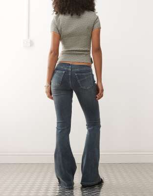 The Ragged Priest Low Rise Buckle Detail Flare Jean In Gray