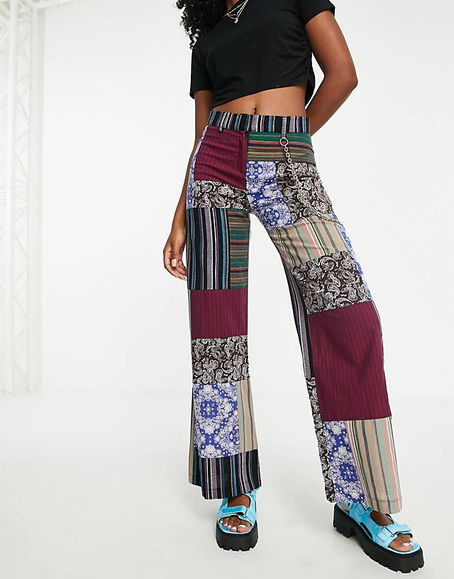The Ragged Priest - low waist cargo trousers in patchwork print with chain